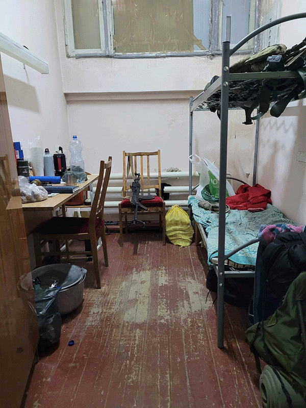 Photo: While meeting with my coworkers, my friends one of the commanders showed me his office which is also where he lives during this time. He had a very palatial room compared to what most had. Most of the officers who were deployed were sleeping on the floor. He had his own room, he has a desk and has a nice bed to lay his gear on when he is taking 5 minutes to rest. There's no cafeteria, no mess hall, no supply train bringing in food and necessities. It's whatever they can find. Whatever they can get from people who donate. From citizens who are willing to give up so they can have something.